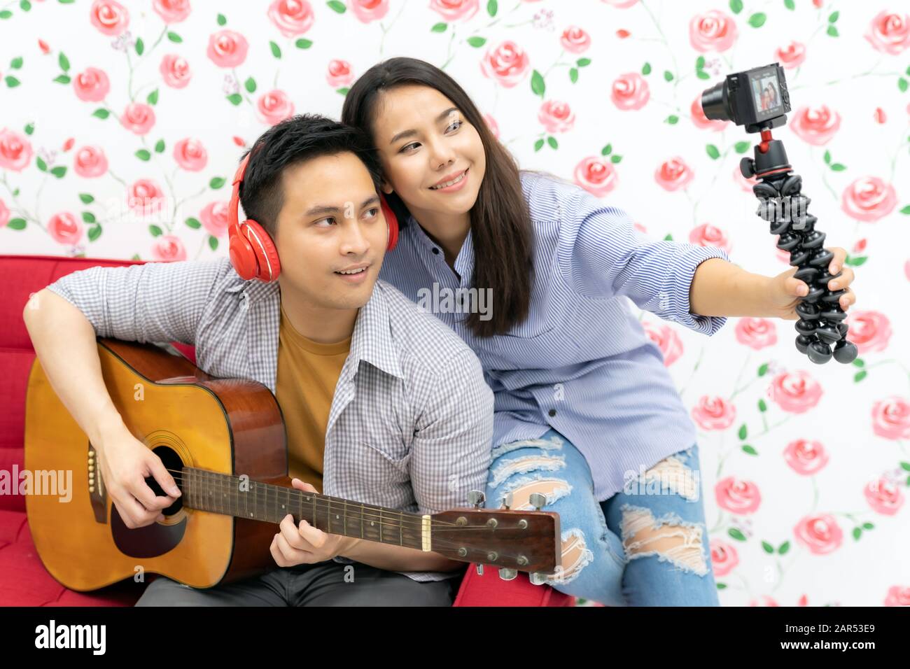 Duo singer do vlog live singing song with guitar to share on social media. Using for vlog social media influencer concept. Stock Photo