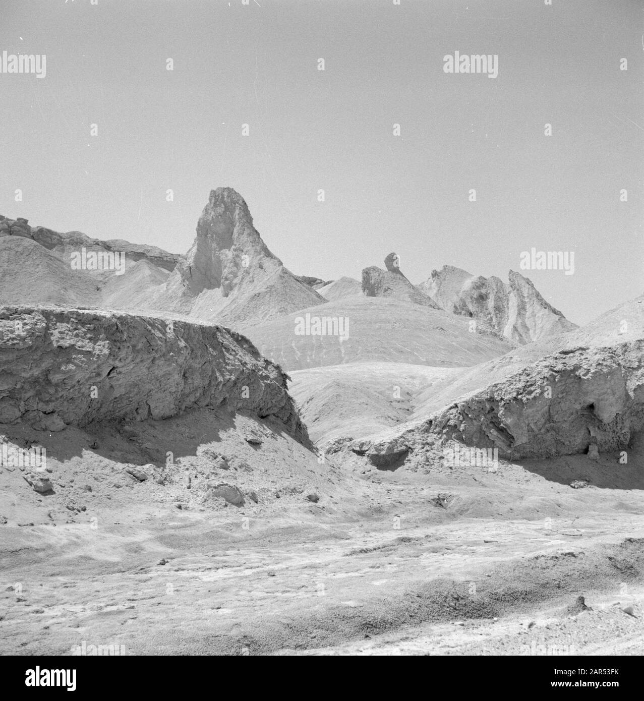 Israel 1964-1965: Dead Sea, Sodom  Whimsical rock formations (salt pillars) on the shore of the Dead Sea Annotation: Salt pillars are a kind of stalagmites of salt. The Bible describes how Lot's wife turned into a pillar of salt when she turned towards the pernicious Sodom. Date: 1964 Location: Dead Sea, Israel, Sodom Keywords: mountains, landscapes, rocks, salt Stock Photo