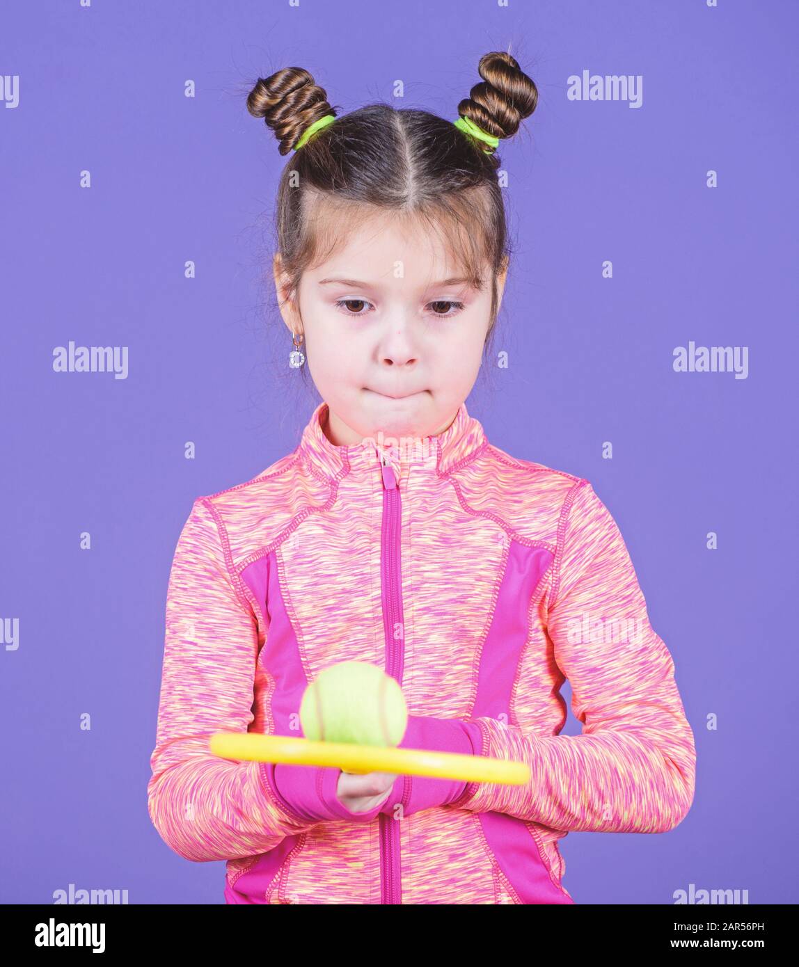 I like playing tennis. Cute tennis player. Little girl child in sport