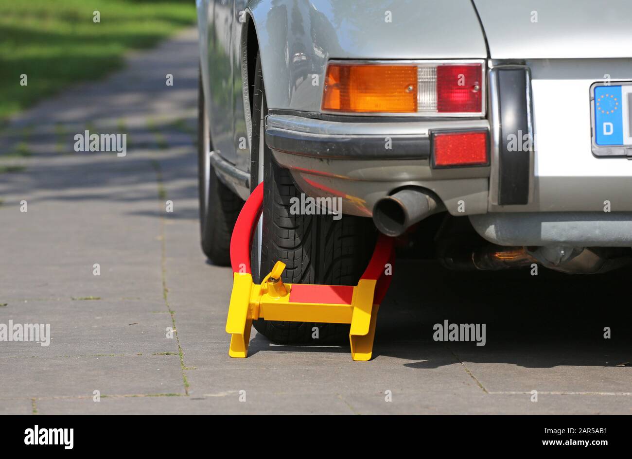 wheel clamp on Porsche old-timer Stock Photo