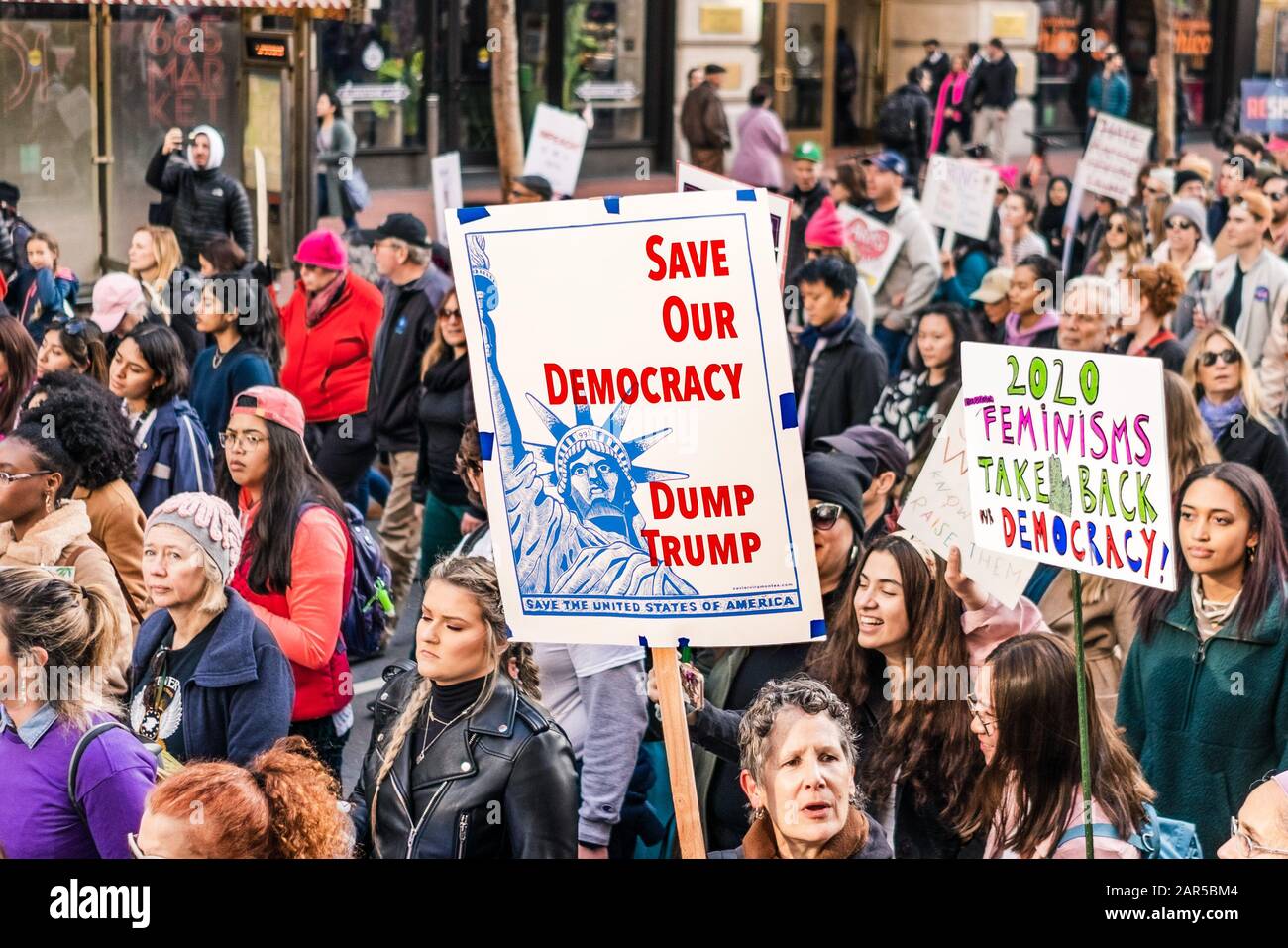 Jan 18, 2020 San Francisco / CA / USA - Participant to the Women's March event holds a sign asking for Trump's removal while marching on Market street Stock Photo