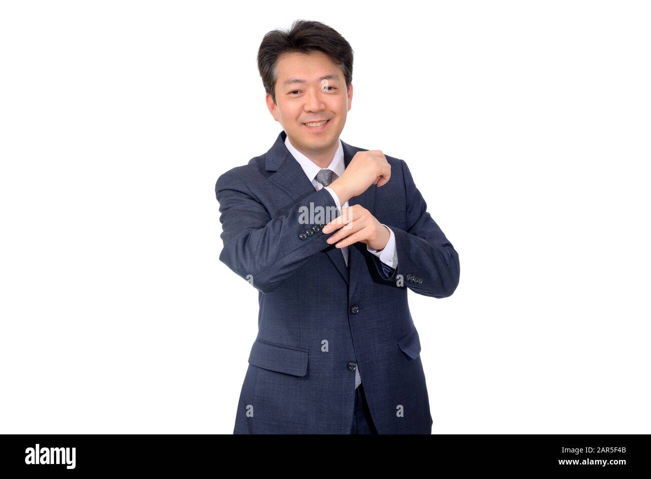 Asian middle-aged businessman making hand gestures on a white background. Stock Photo