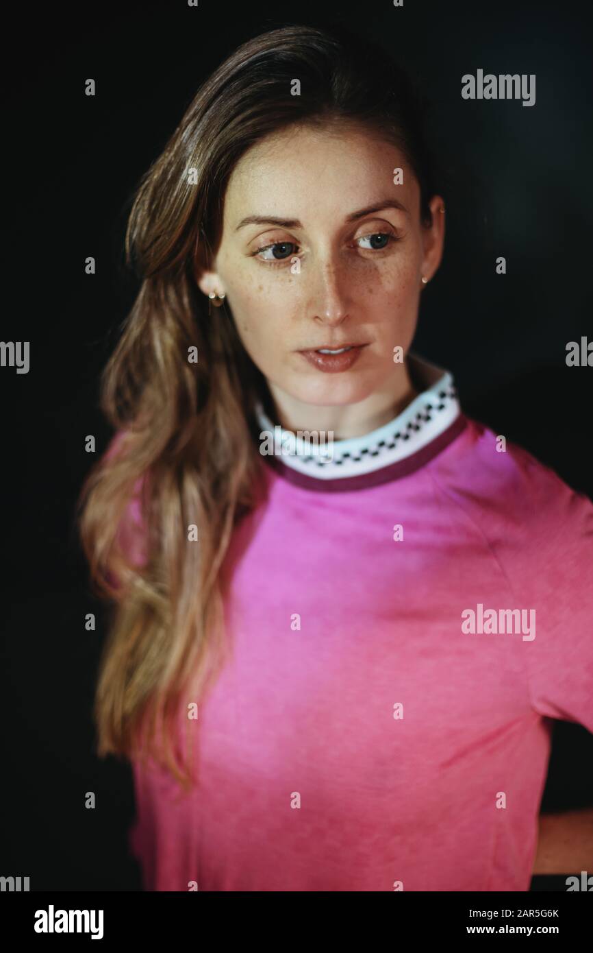 Blonde woman wearing pink shirt hi-res stock photography and images - Alamy