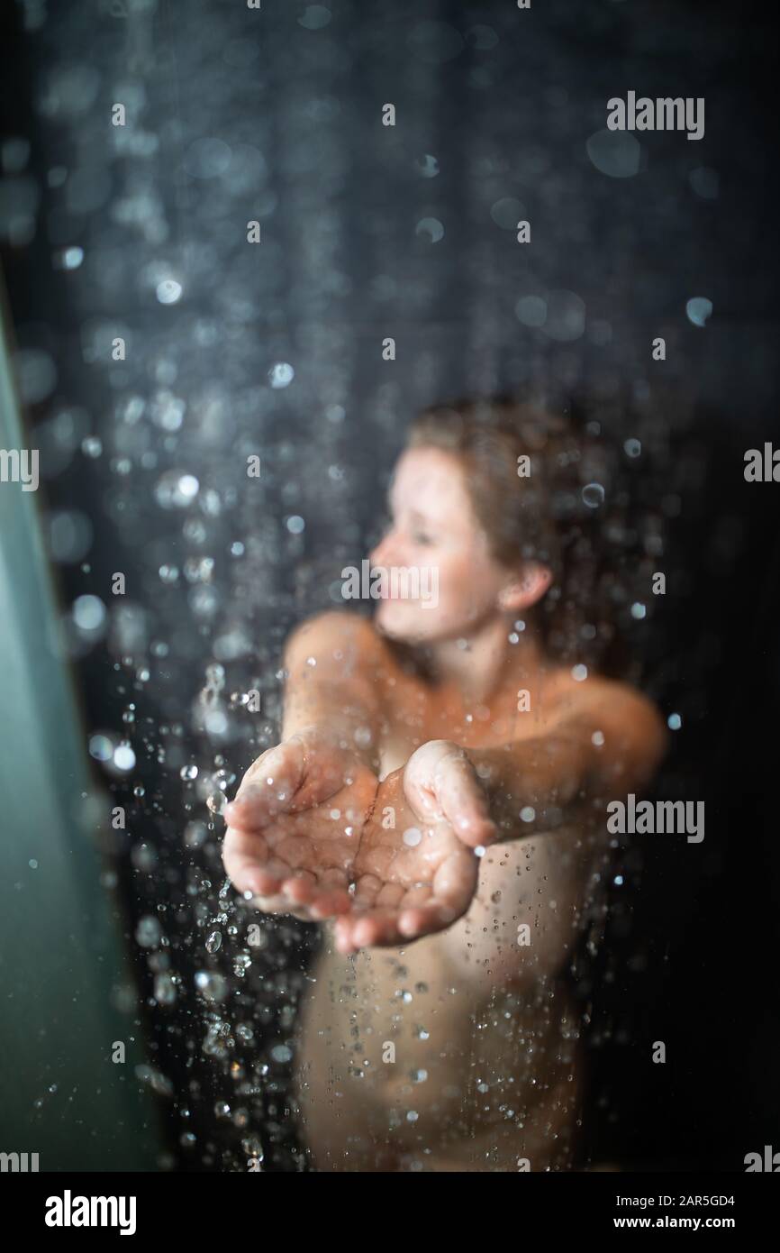 Woman taking a shower back hi-res stock photography and images - Alamy