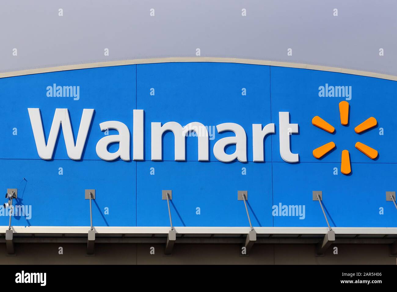 A Walmart logo at one of their supercenters in Philadelphia, Pennsylvania. Stock Photo