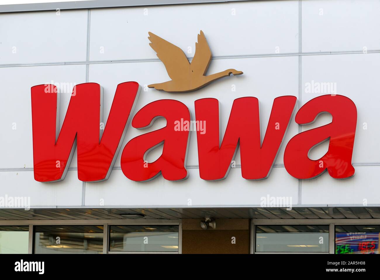 A Wawa logo at one of their convenience stores in Philadelphia, PA. Stock Photo