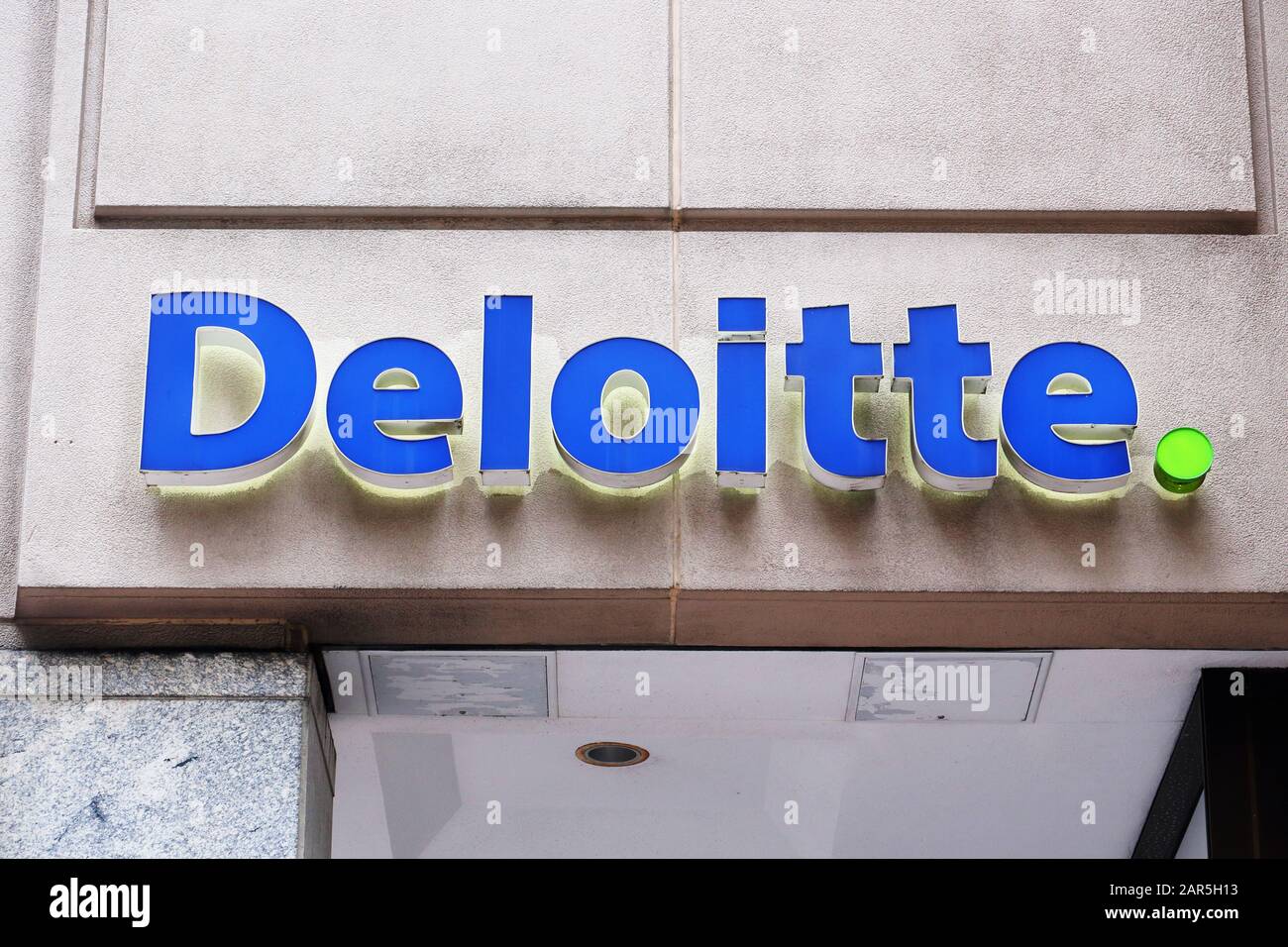 A Deloitte logo on a building on Market St in Philadelphia, PA. Stock Photo