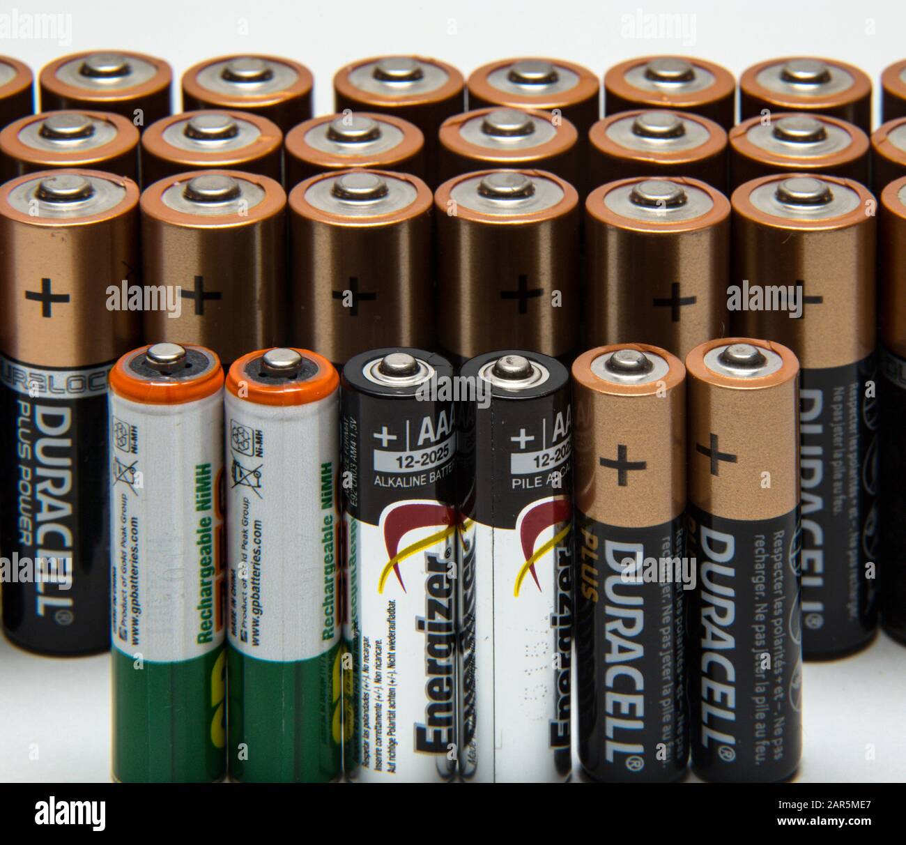 Alkaline and rechargeable batteries, AA, AAA, cells,power. Stock Photo