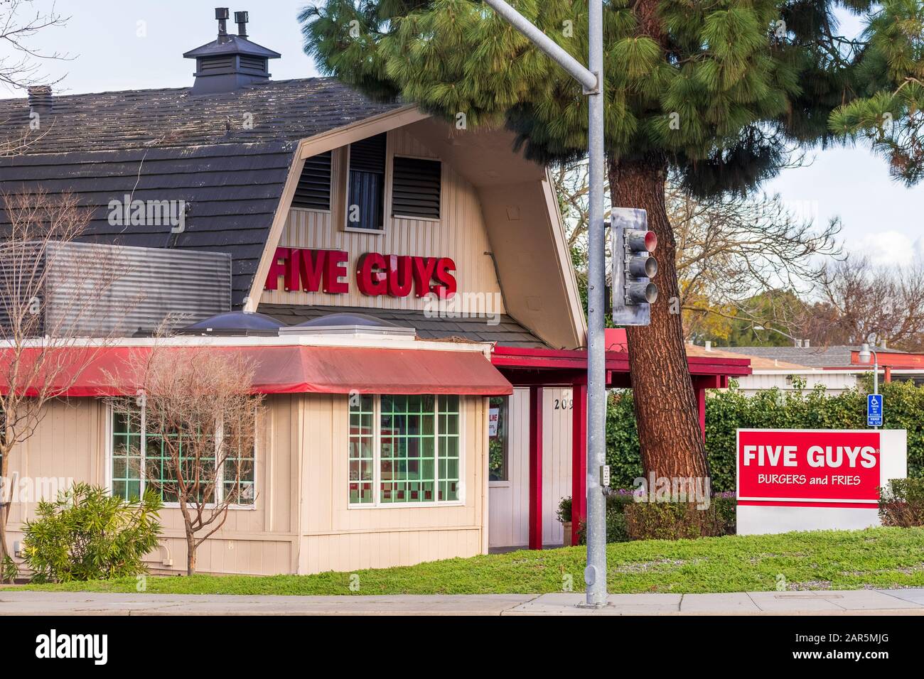 Jan 24, 2020 Mountain View / CA / USA - Five Guys Burgers and Fries fast food location in San Francisco Bay Area; Five Guys Enterprises LLC is an Amer Stock Photo