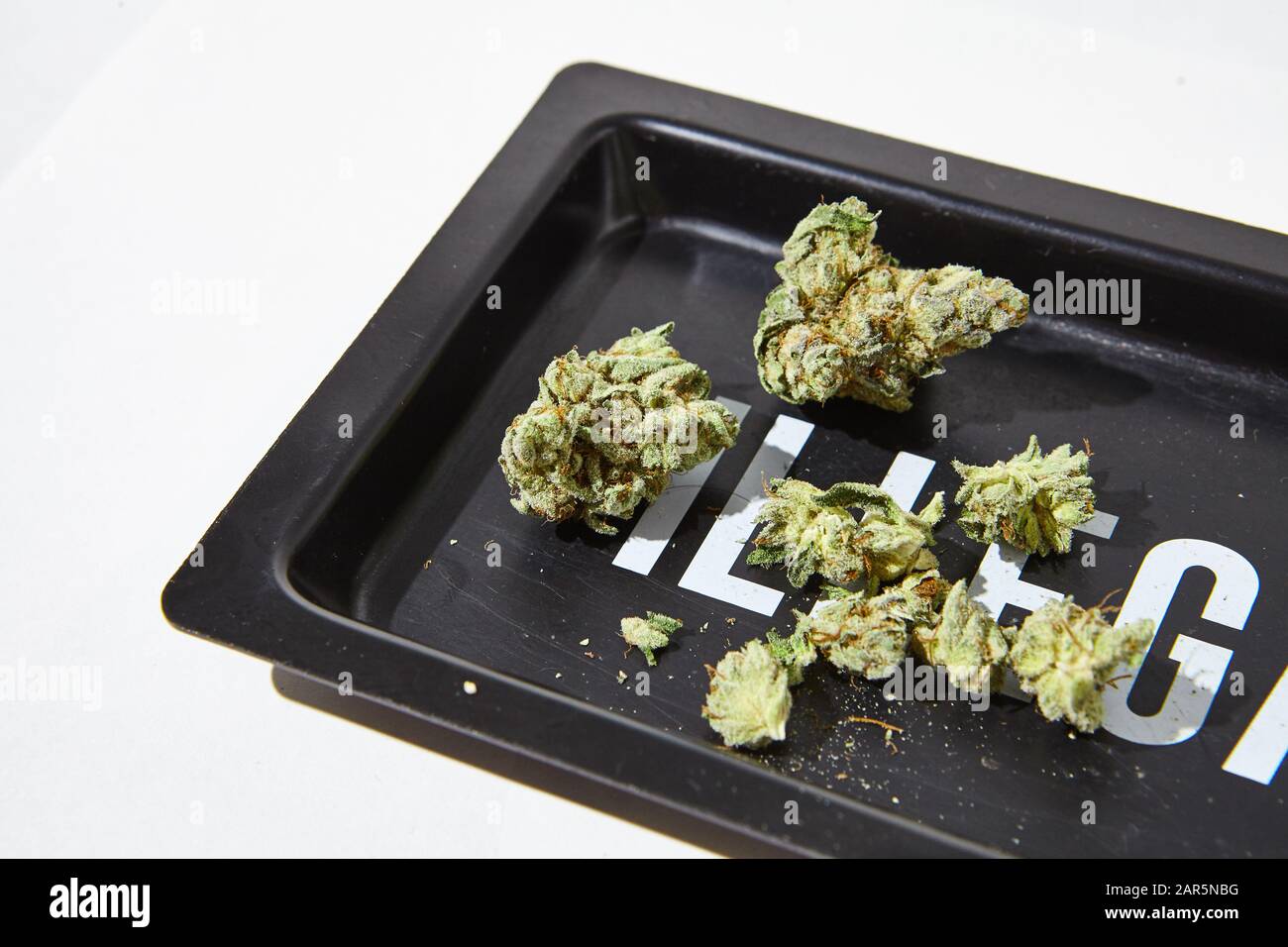 Cannabis Flower on ILLEGAL rolling tray Stock Photo