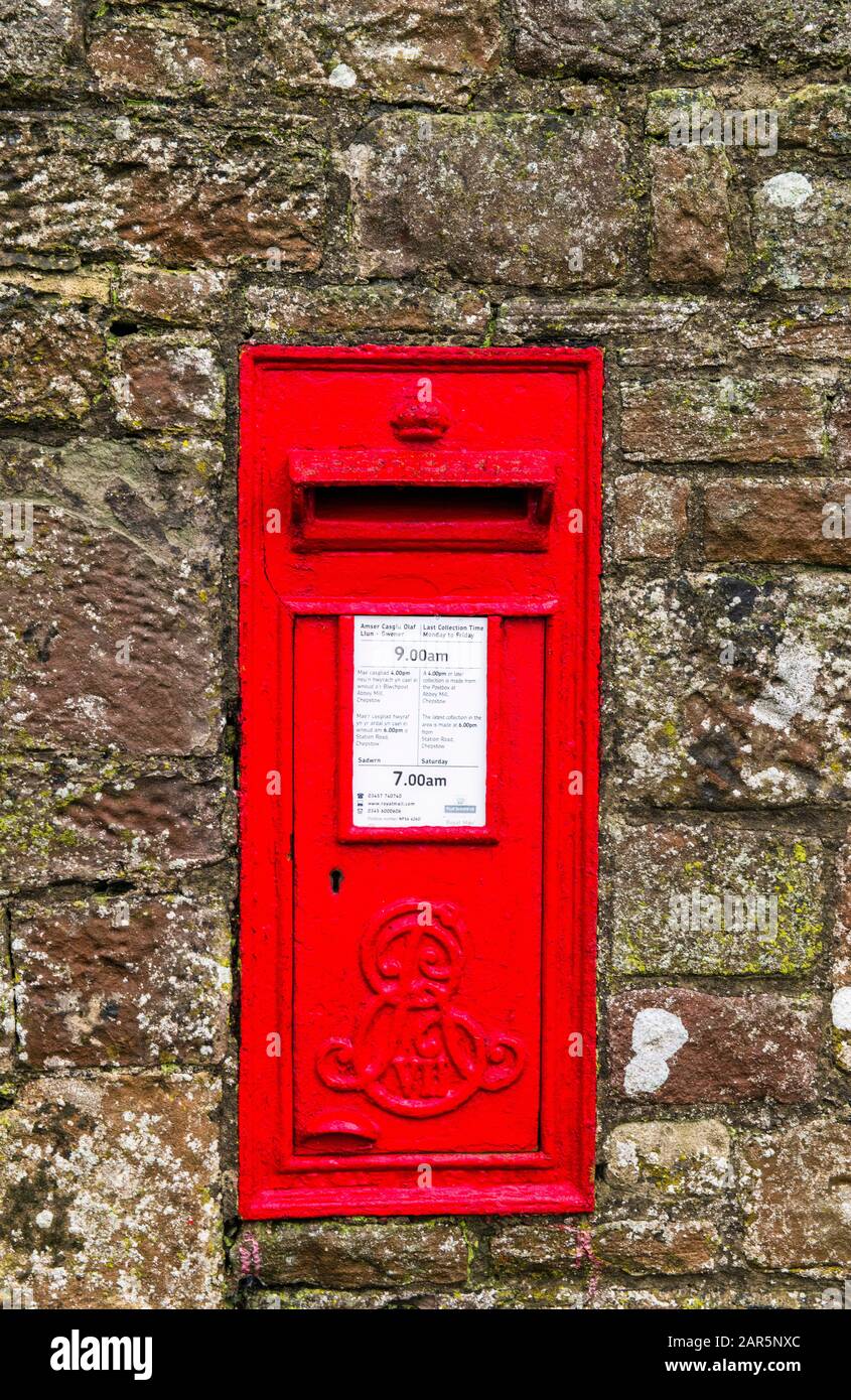 Red Edward VIIth Letter Box in the stone wall opposite Tintern Abbey in Tintern Wye Valley Monmouthshire south Wales Stock Photo
