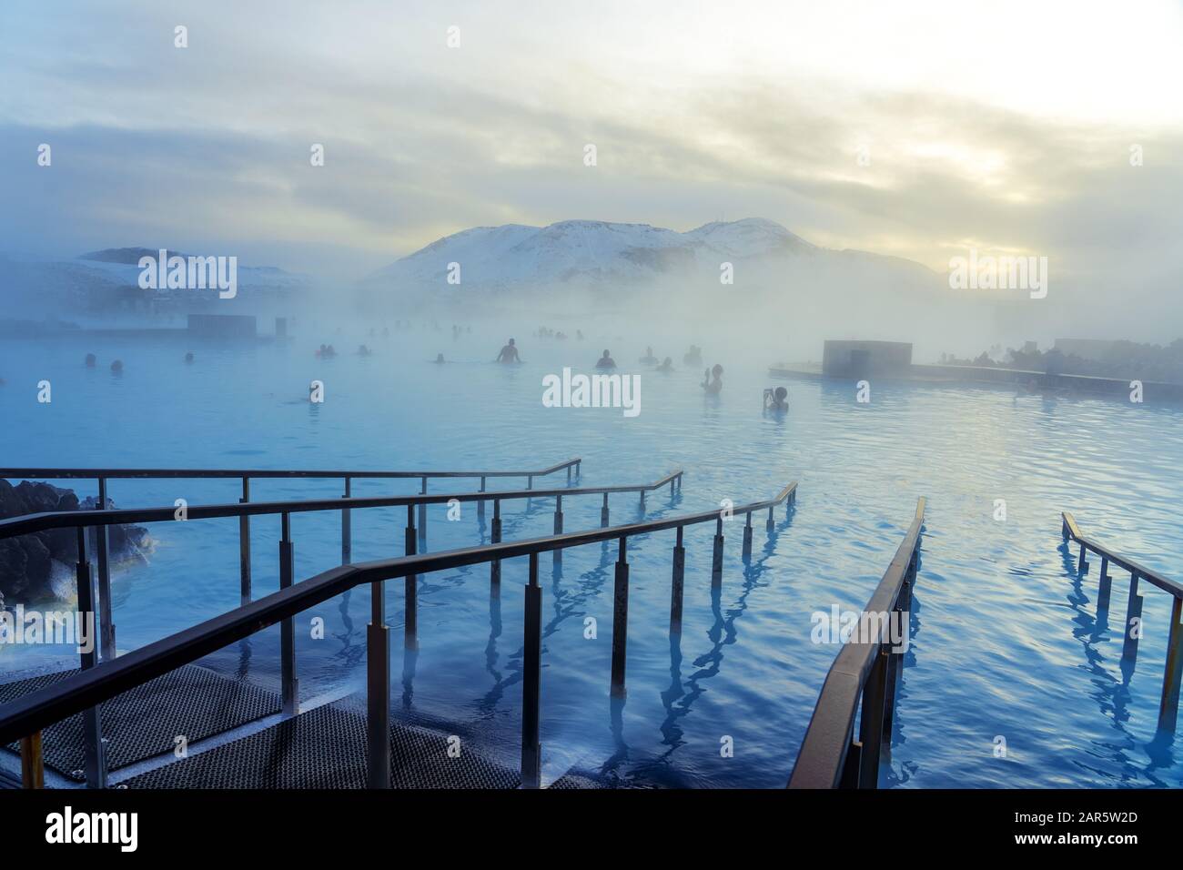 Blue Lagoon next to Reykjavik with people bathing in this natural hot spring . Stock Photo