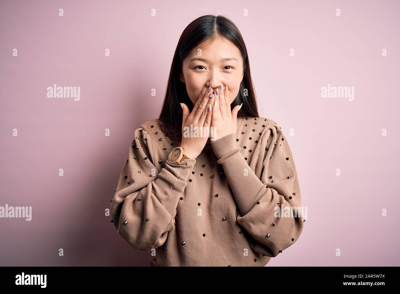 Japanese woman covering mouth laughing hires stock photography and