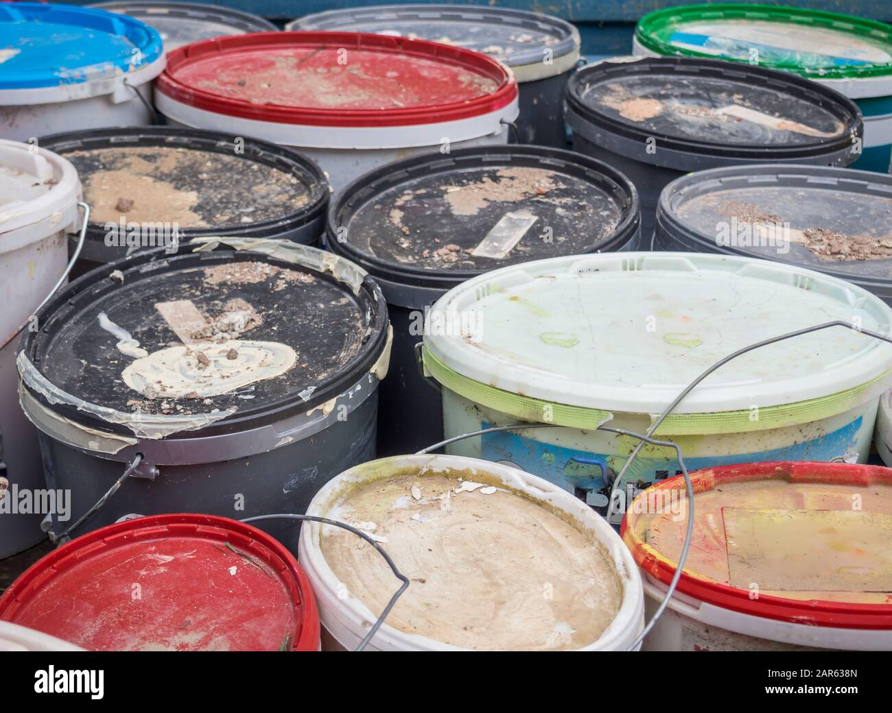 Old paint buckets industry background Stock Photo Alamy