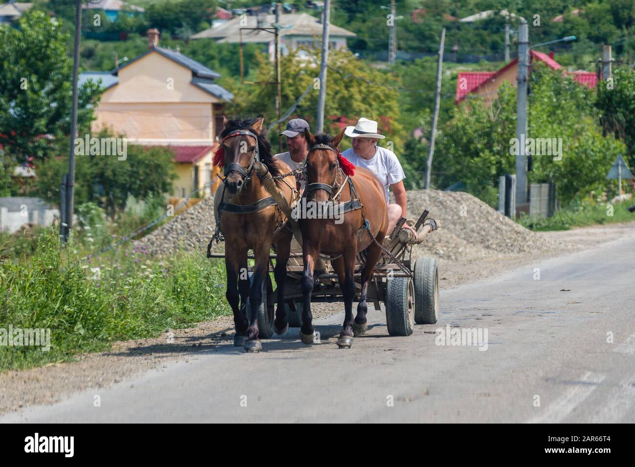 Farm wagon on a road in rural area of Romania Stock Photo