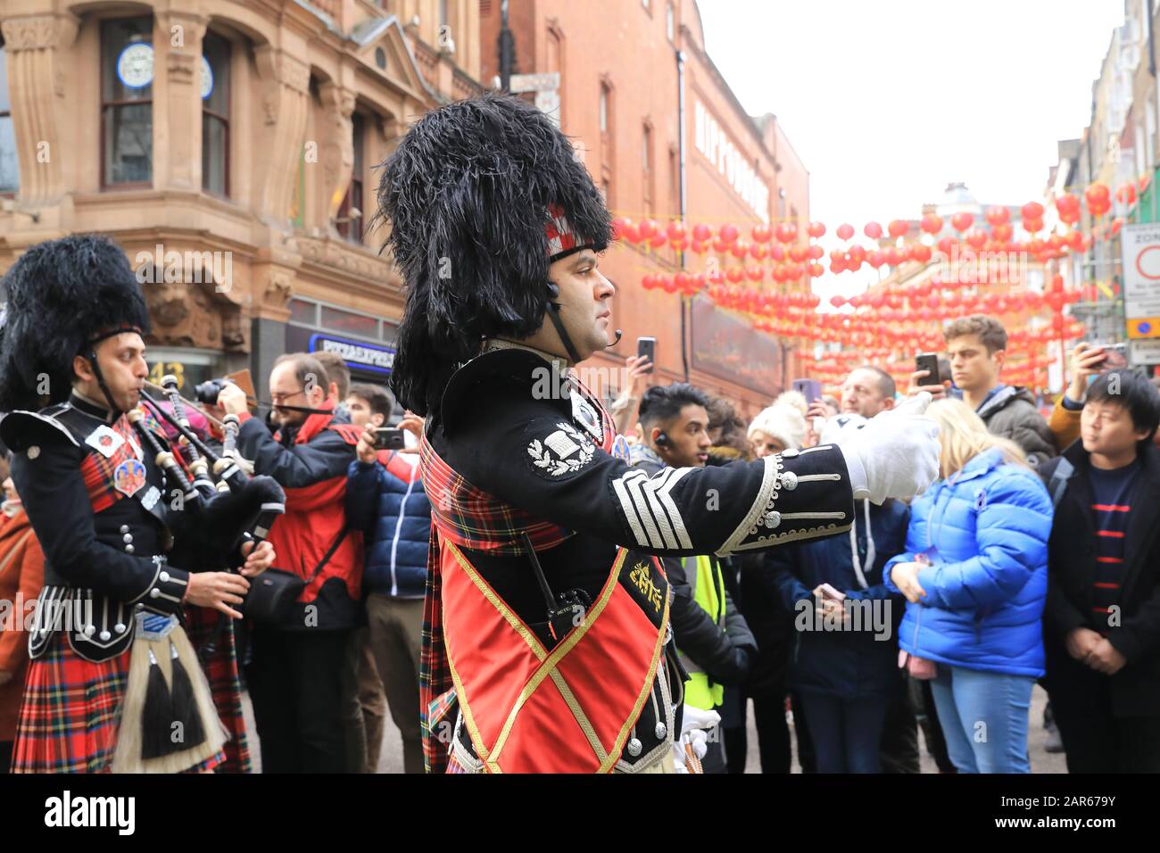 The unusual sight of the Shree Muktajeevan Pipe Band at the Chinese New Year 2020, being celebrated in London with the annual parade, bringing in the Year of the Rat. Stock Photo