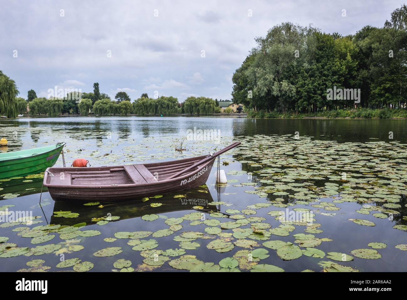 Small boat on a water canal in Augustow city situated in the Podlaskie Voivodeship in north eastern Poland Stock Photo