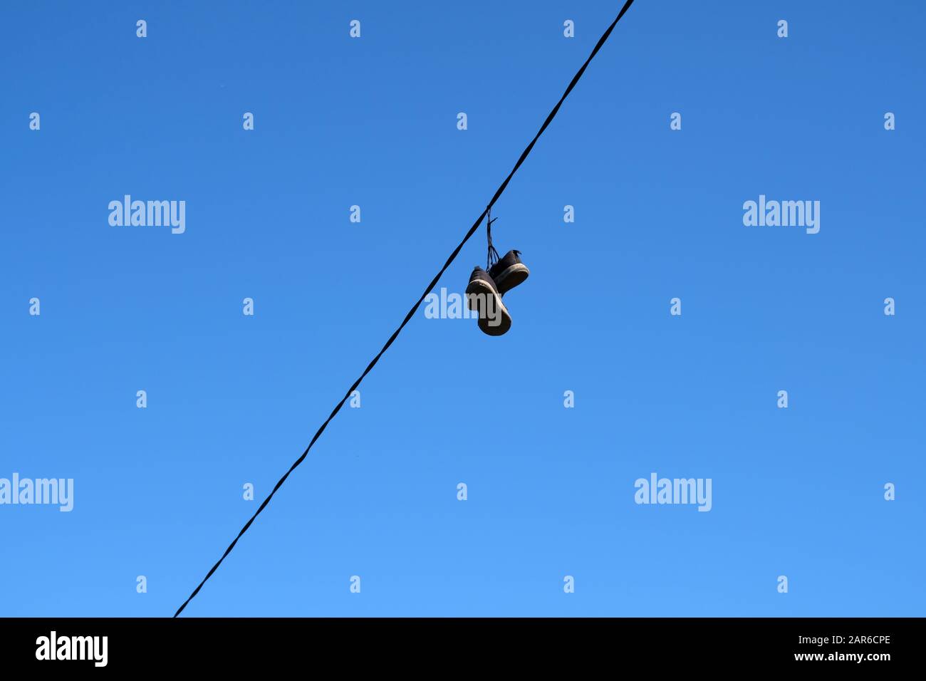 Sneakers hanging telephone wire hires stock photography and images Alamy
