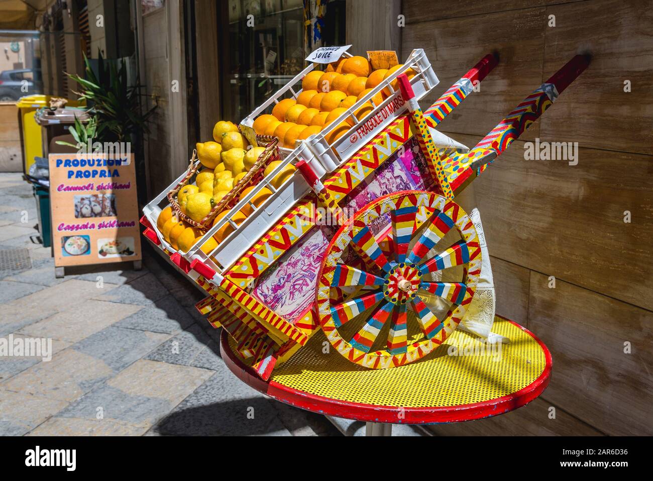 Carretto siciliano - traditional Sicilian cart in front of a grocery store in Trapani city on the west coast of Sicily in Italy Stock Photo