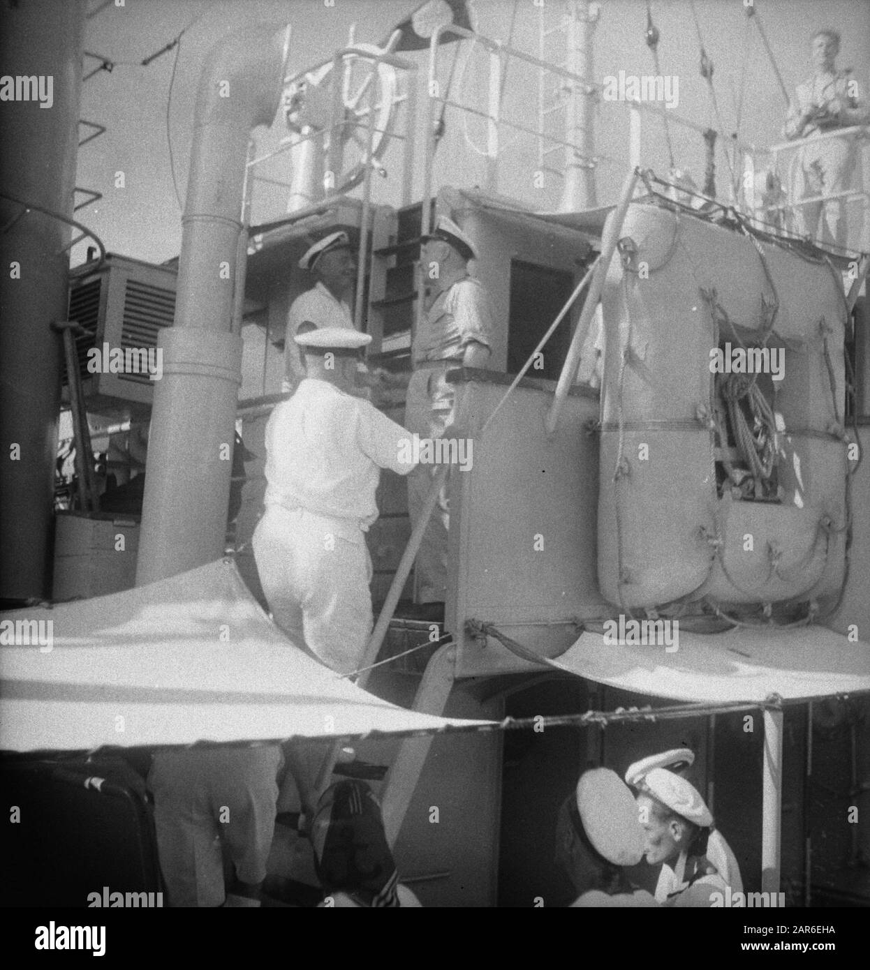 Arrival Julianadok in Surabaya  Navy officers on a naval tug. Right standing Deputy Admiral A. S. Pinke Date: 10 April 1947 Location: Indonesia, Dutch East Indies, Surabaya Personal name: Pinke, A.S. Stock Photo