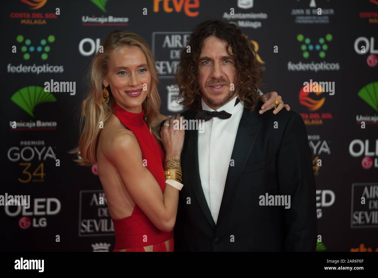 Spanish former footballer Carles Puyol poses with his partner model Vanesa Lorenzo attend the 34th edition of Spanish Film Academy's Goya Awards ceremony, at Jose Maria Martin Carpena sport palace. Stock Photo