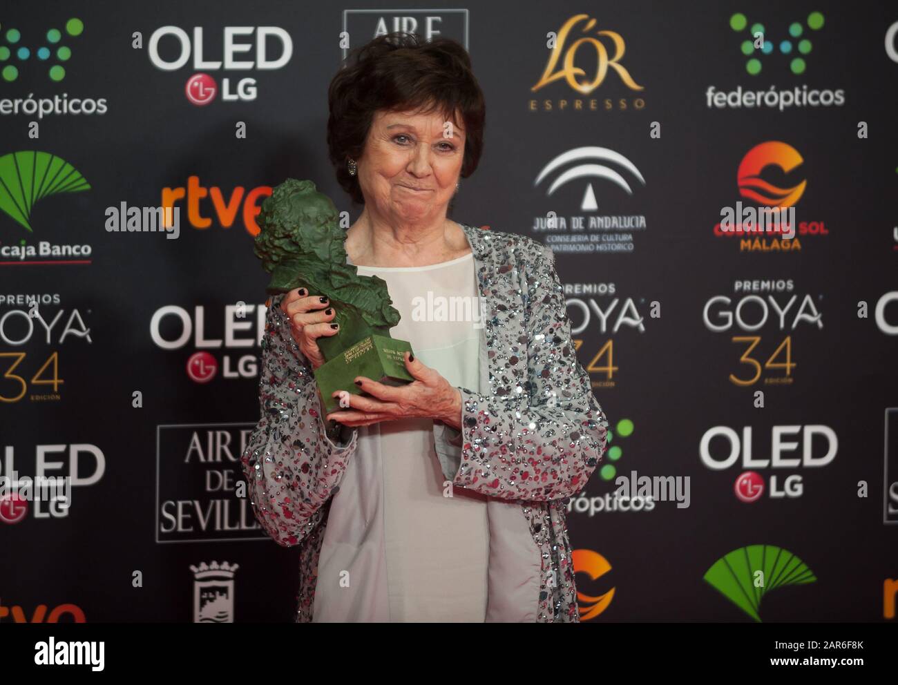 Spanish actress Julieta Serrano poses with the Goya award for the best supporting actress on the role in 'Dolor y Gloria' (Pain and Glory)  during a photocall of the 34th edition of Spanish Film Academy's Goya Awards ceremony, at Jose Maria Martin Carpena Sport Palace. Stock Photo