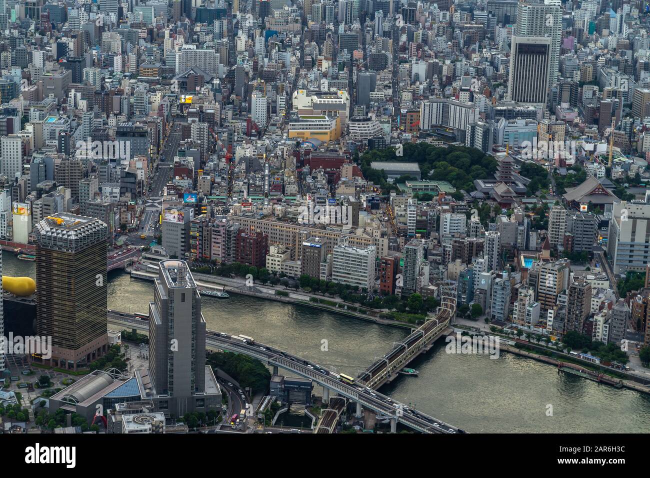Aerial view from Tokyo Skytree tower of Asahi building headquarters along Sumida Rivere and Sensoji temple, Japan Stock Photo