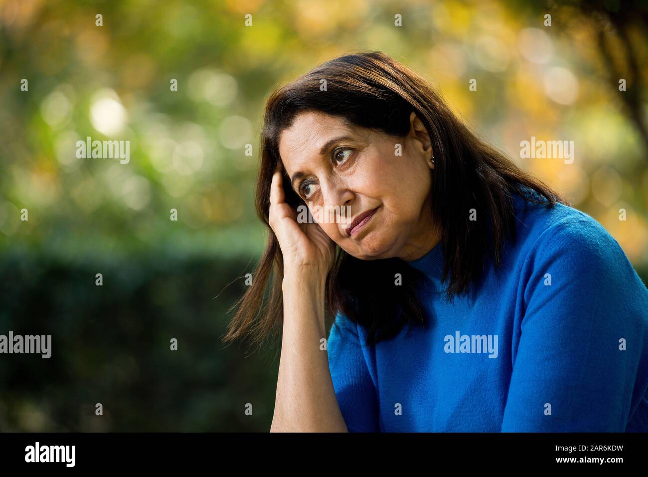 Old woman head in hands hi-res stock photography and images - Alamy