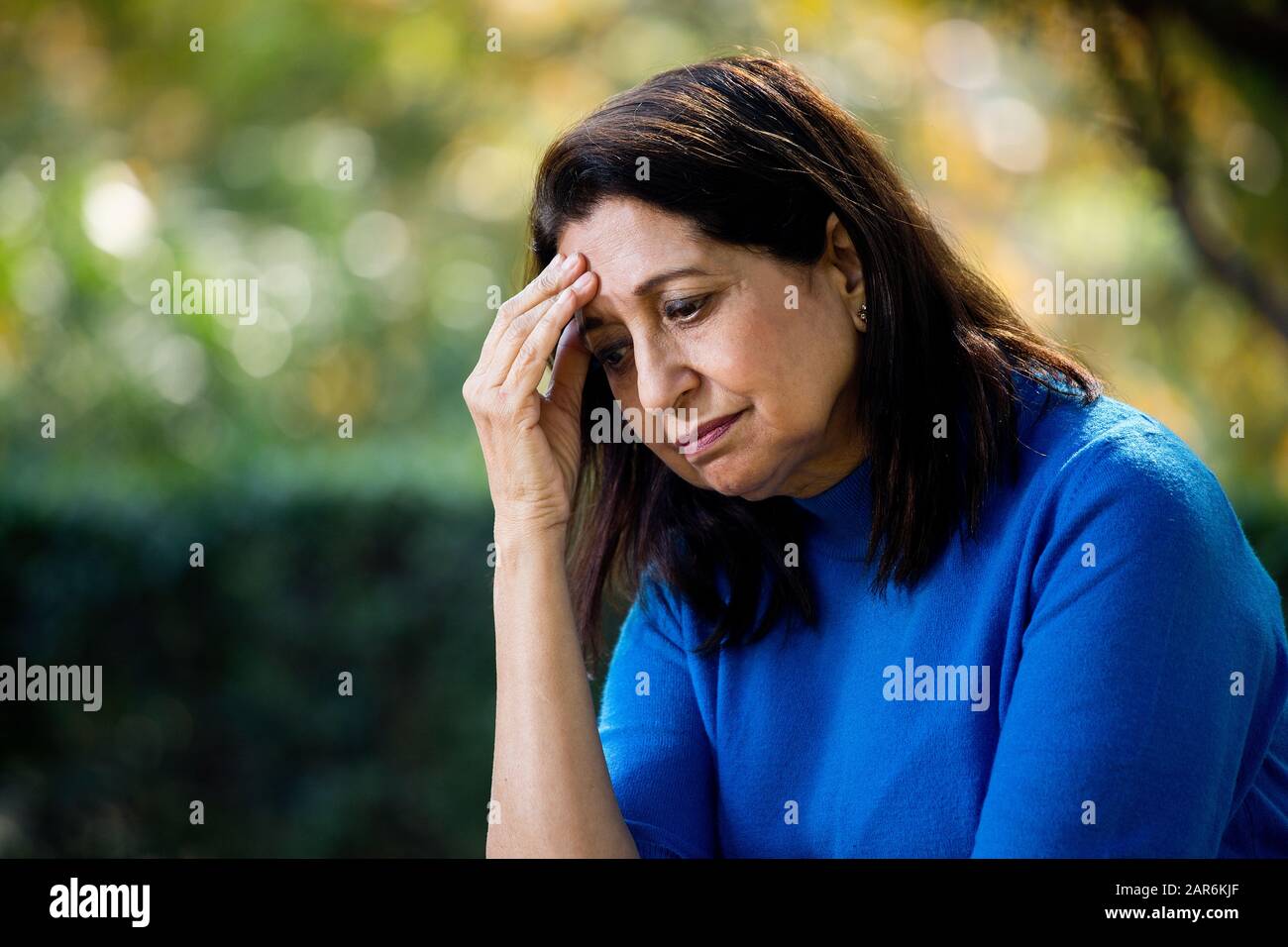 Old woman head in hands hi-res stock photography and images - Alamy
