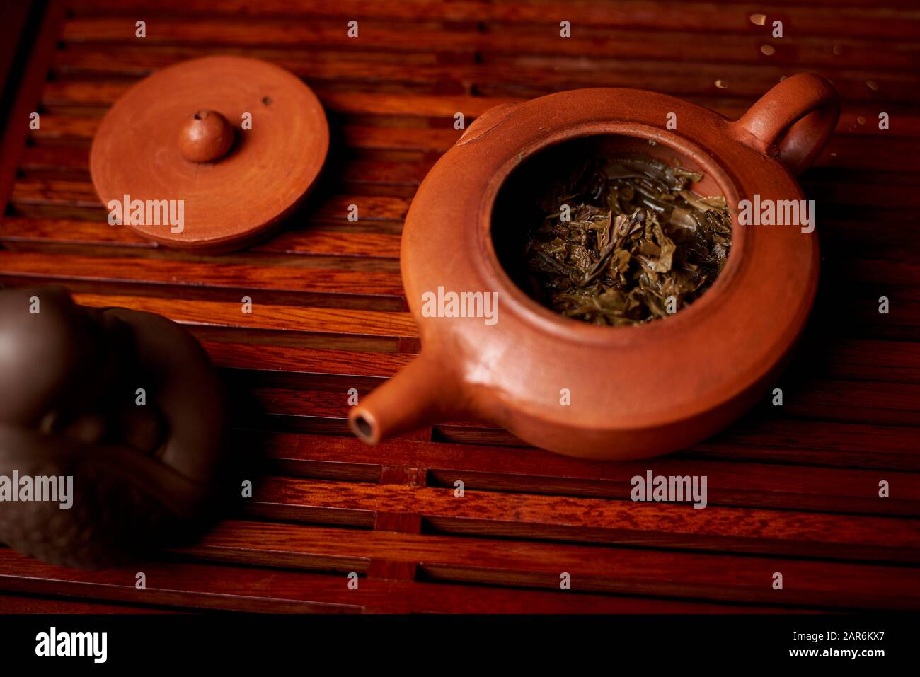 Brewed tea leaves in a teapot. Stock Photo