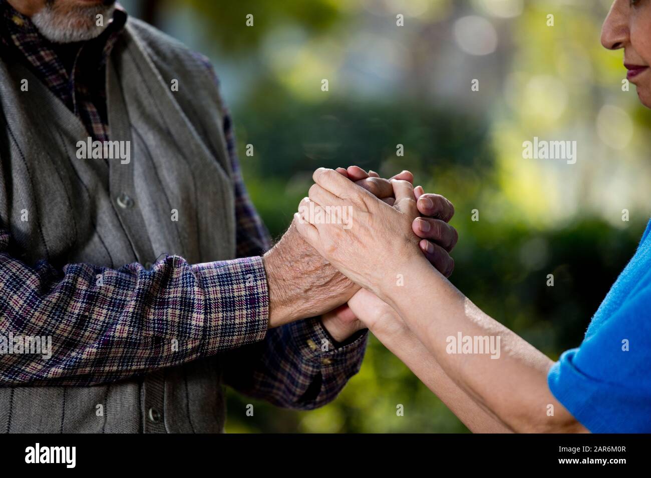 Two indian men holding hands hi-res stock photography and images - Alamy