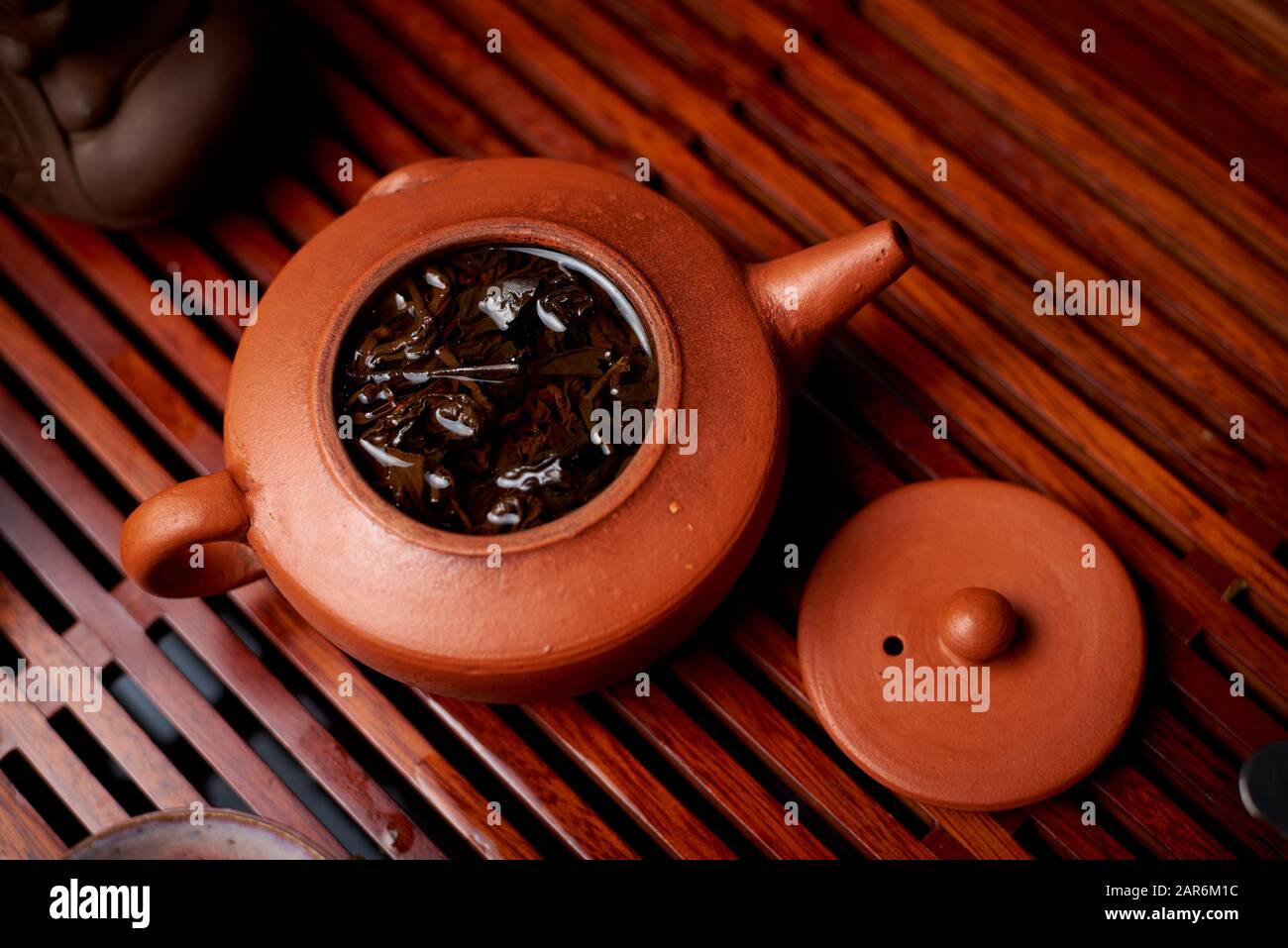 Brewed tea leaves in a teapot. Stock Photo
