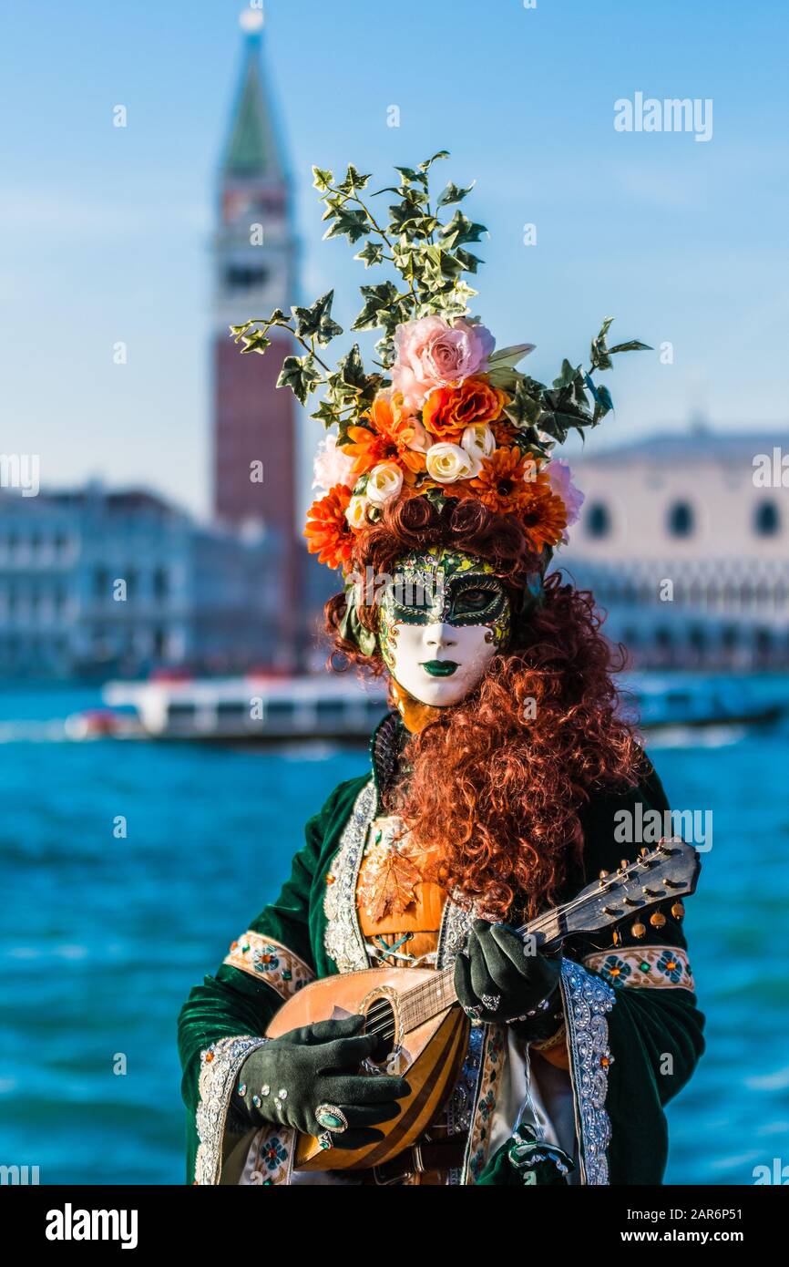 imaginative mask in splendid costume at the carnival in Venice. The ...
