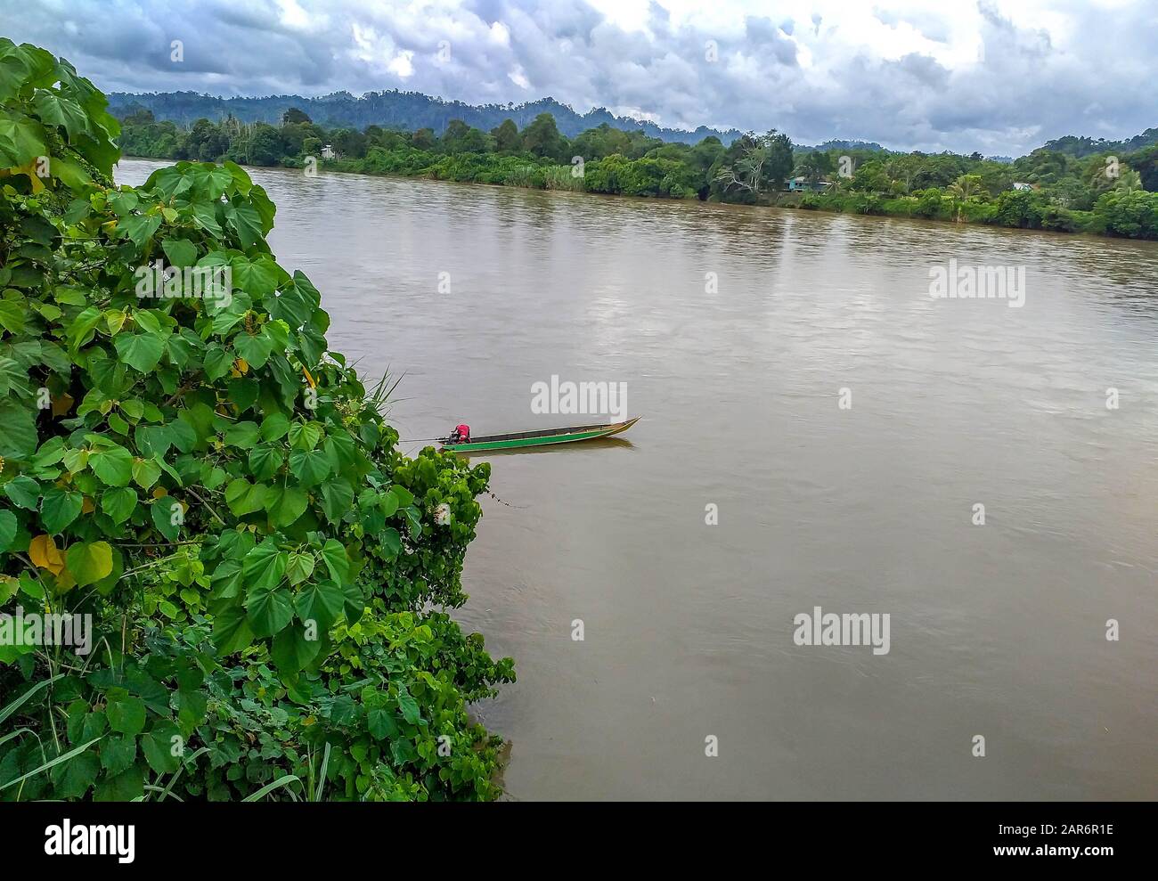 A Man Drifting His Boat On Mentarang River Malinau Borneo Indonesia Stock Photo Alamy