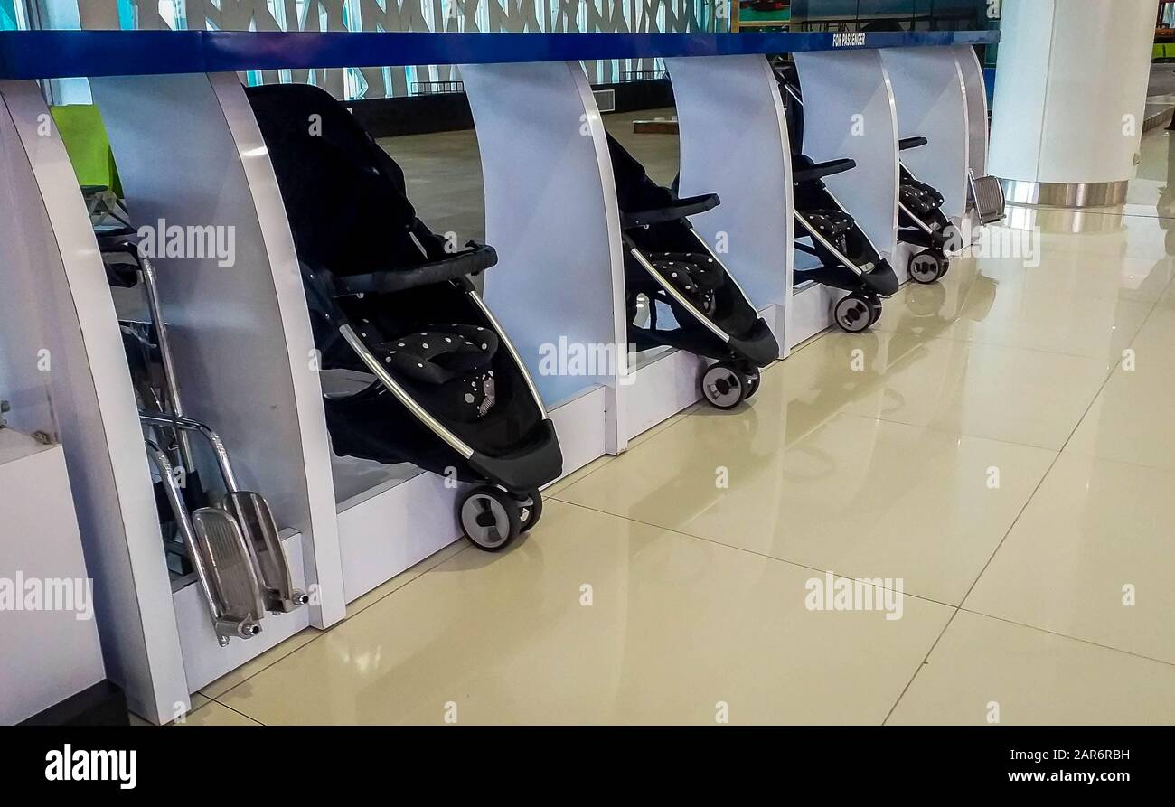 Free wheelchair and infant stroller for passenger in the airport Stock Photo