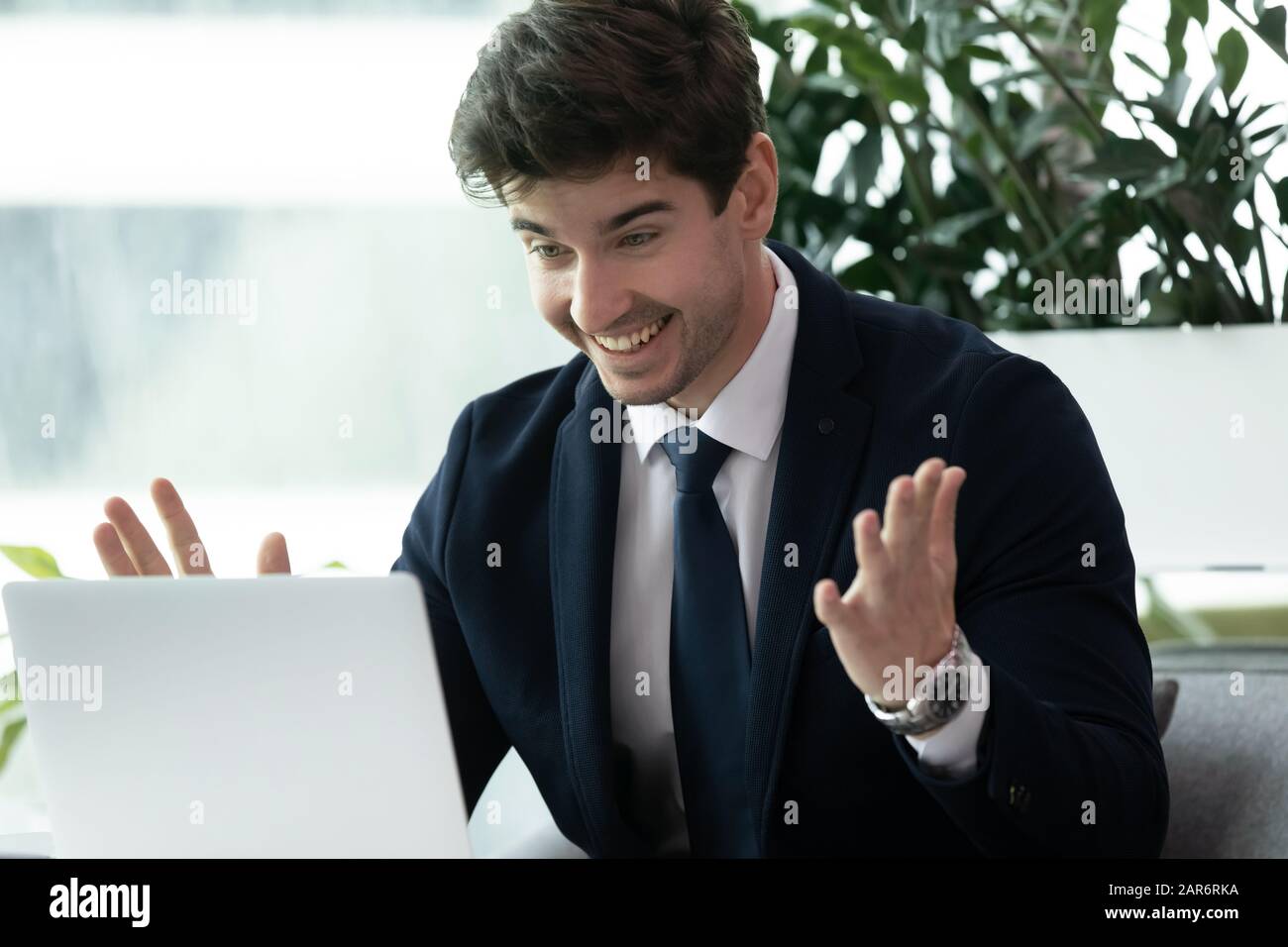 Surprised man looking computer screen hi-res stock photography and ...