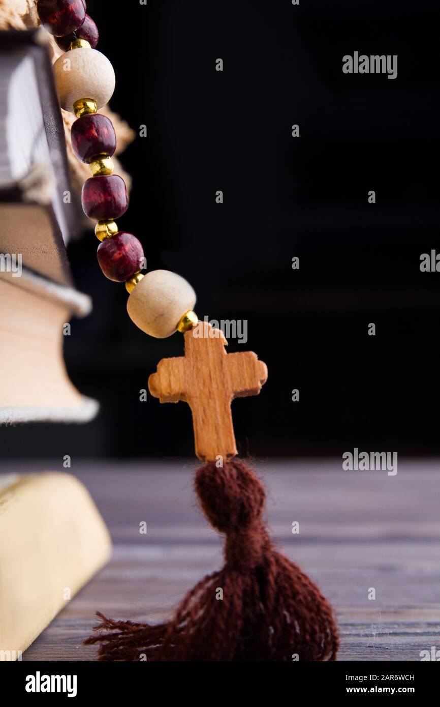 Catolic roman rosary with wooden cross. Stock Photo