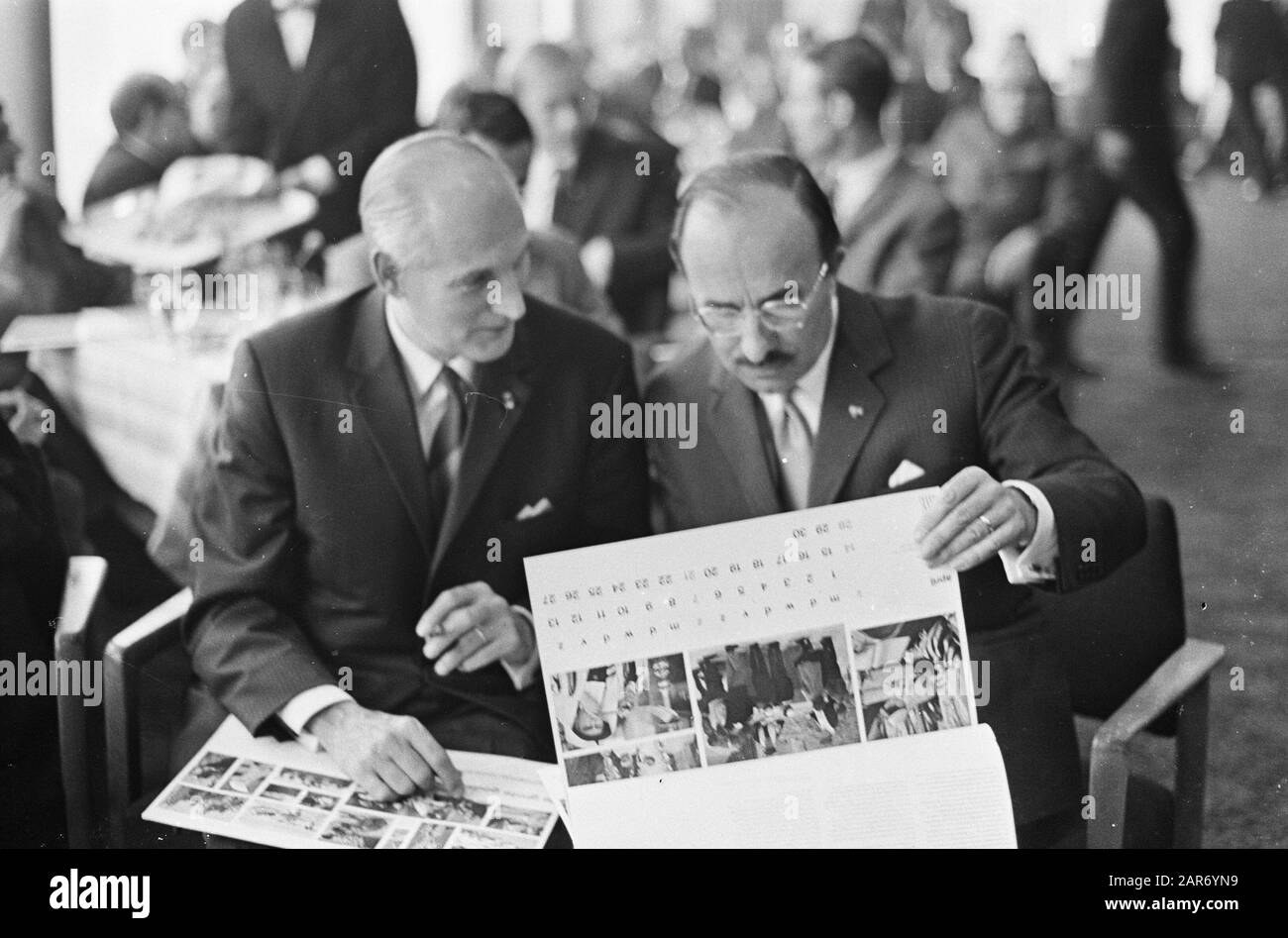 New Mission calendar, introduced by Minister of State mr. Cals. Mr. Bot and Mr. Cals browse calendar Date: September 25, 1967 Keywords: CALENDERS Personname: Bot, mr., Cals, Jo Stock Photo