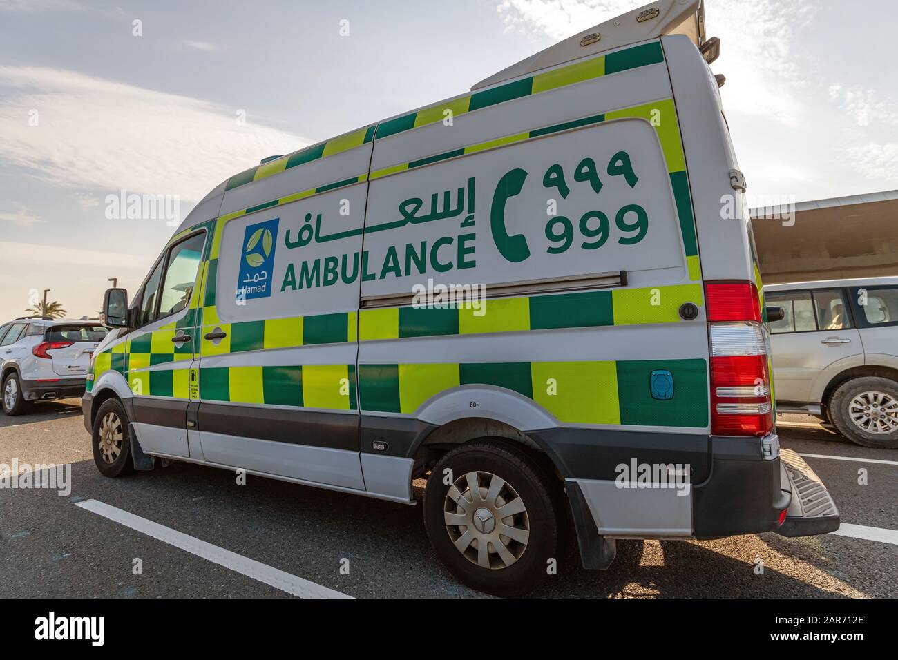Doha, Qatar - Nov 26. 2019 Hamad Medical Corporation Ambulance car on Doha street Stock Photo