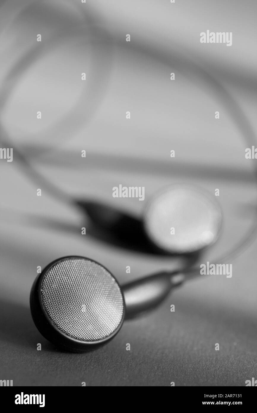Black and white close up shot of an earphone. Stock Photo