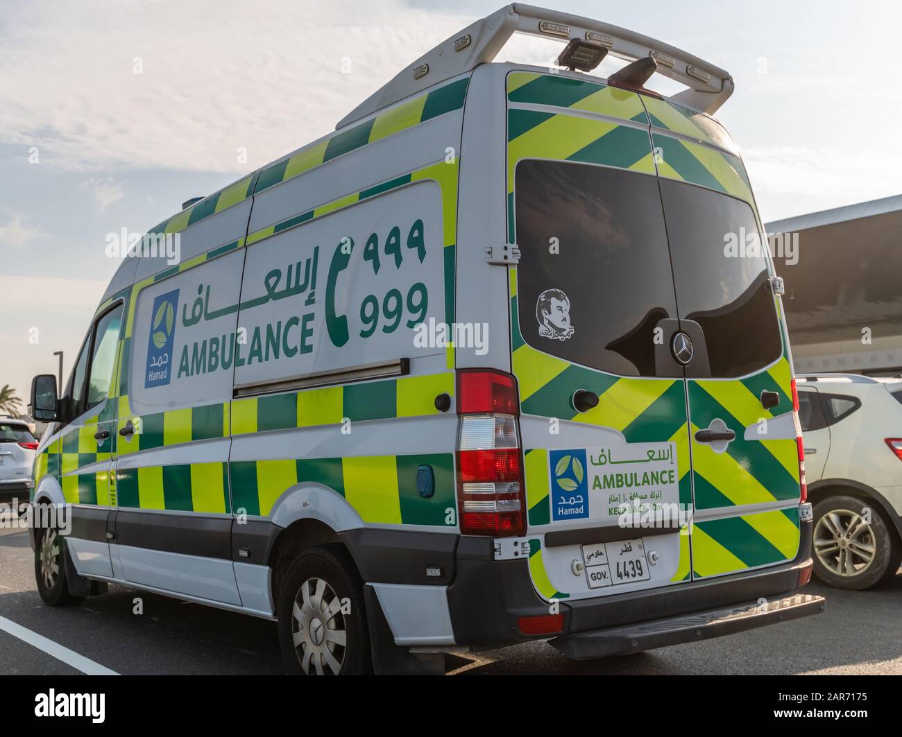 Doha, Qatar - Nov 26. 2019 Hamad Medical Corporation Ambulance car on Doha street Stock Photo