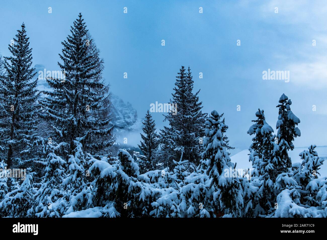 Clouds carrying snow in the italian alps Stock Photo - Alamy