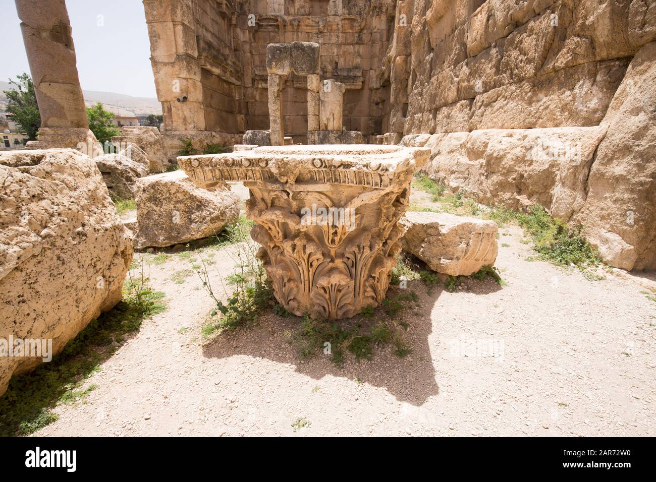 The capital of a column in the Propylaeae. The ruins of the Roman city of Heliopolis or Baalbek in the Beqaa Valley. Baalbek, Lebanon - June, 2019 Stock Photo