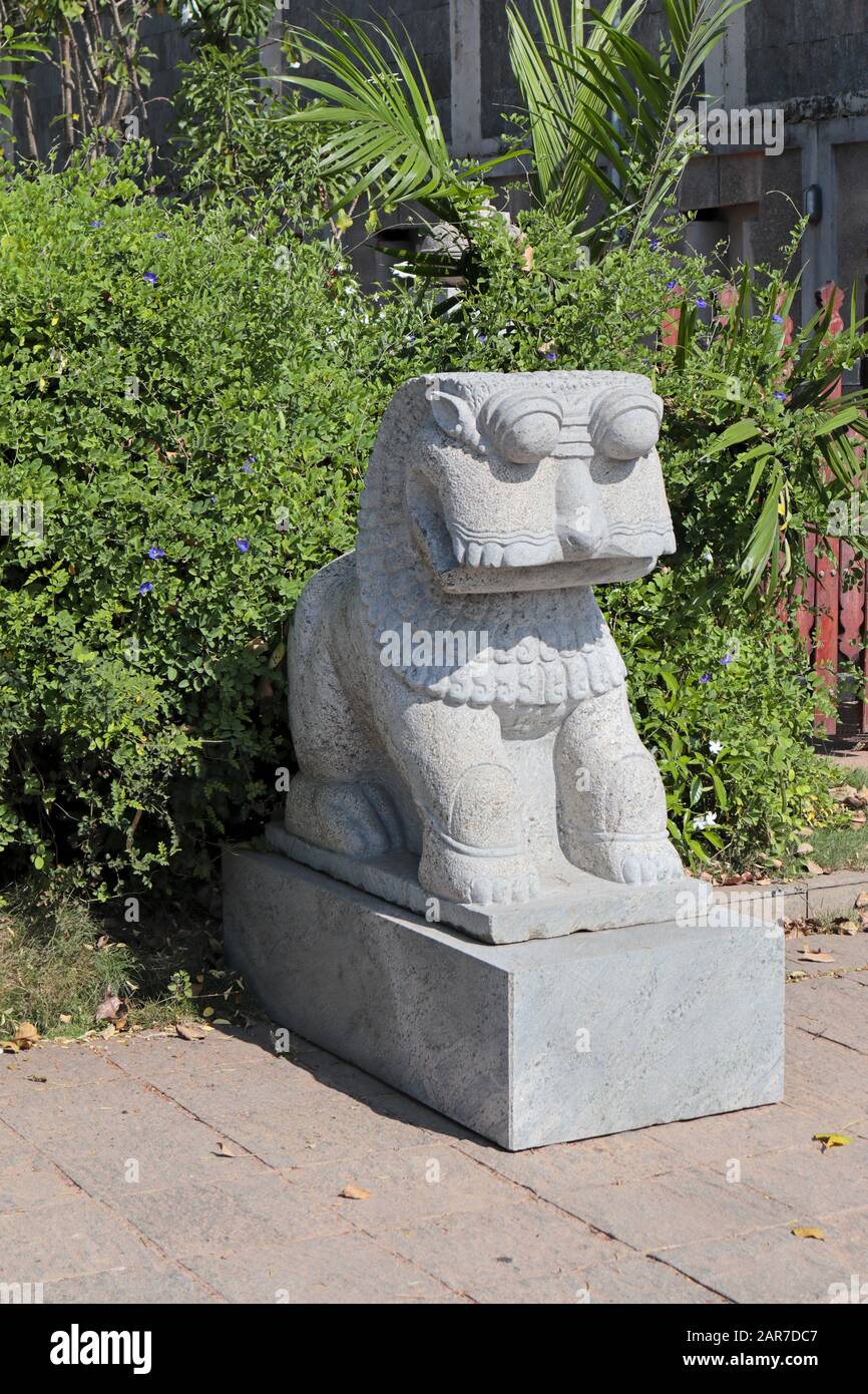 Stylised Lion Sculpture at the foot of the Aukana Buddha statue, Colombo, Sri Lanka Stock Photo