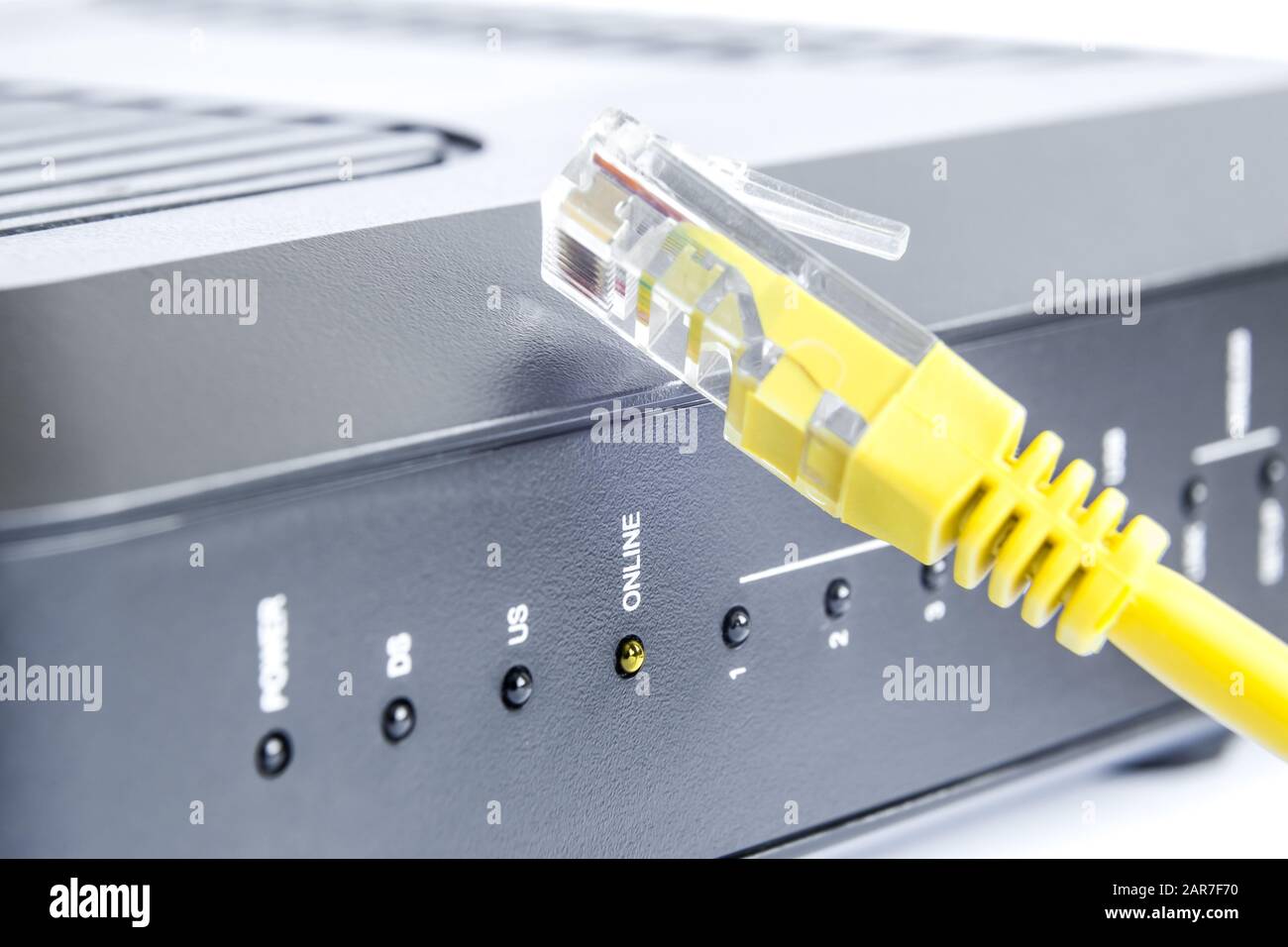 Router with led lamps and yellow cat cable Stock Photo Alamy