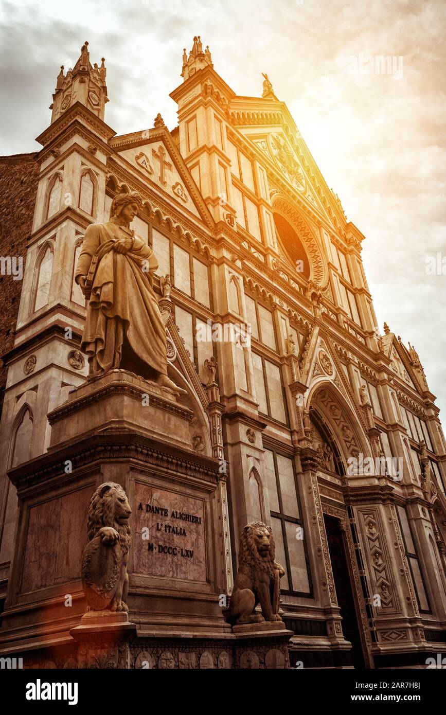 Basilica di Santa Croce with monument to Dante, Florence, Italy. It is one of the main landmarks of Florence. Beautiful view of Santa Croce facade in Stock Photo