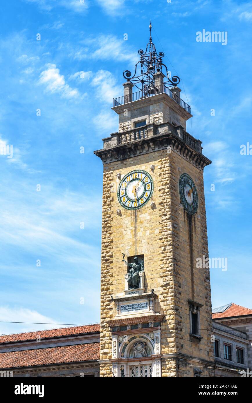 Bell tower in Citta Bassa in Bergamo, Italy. Old architecture of Lower City in Bergamo. Belfry or campanile with clock in the ancient town of Bergamo Stock Photo