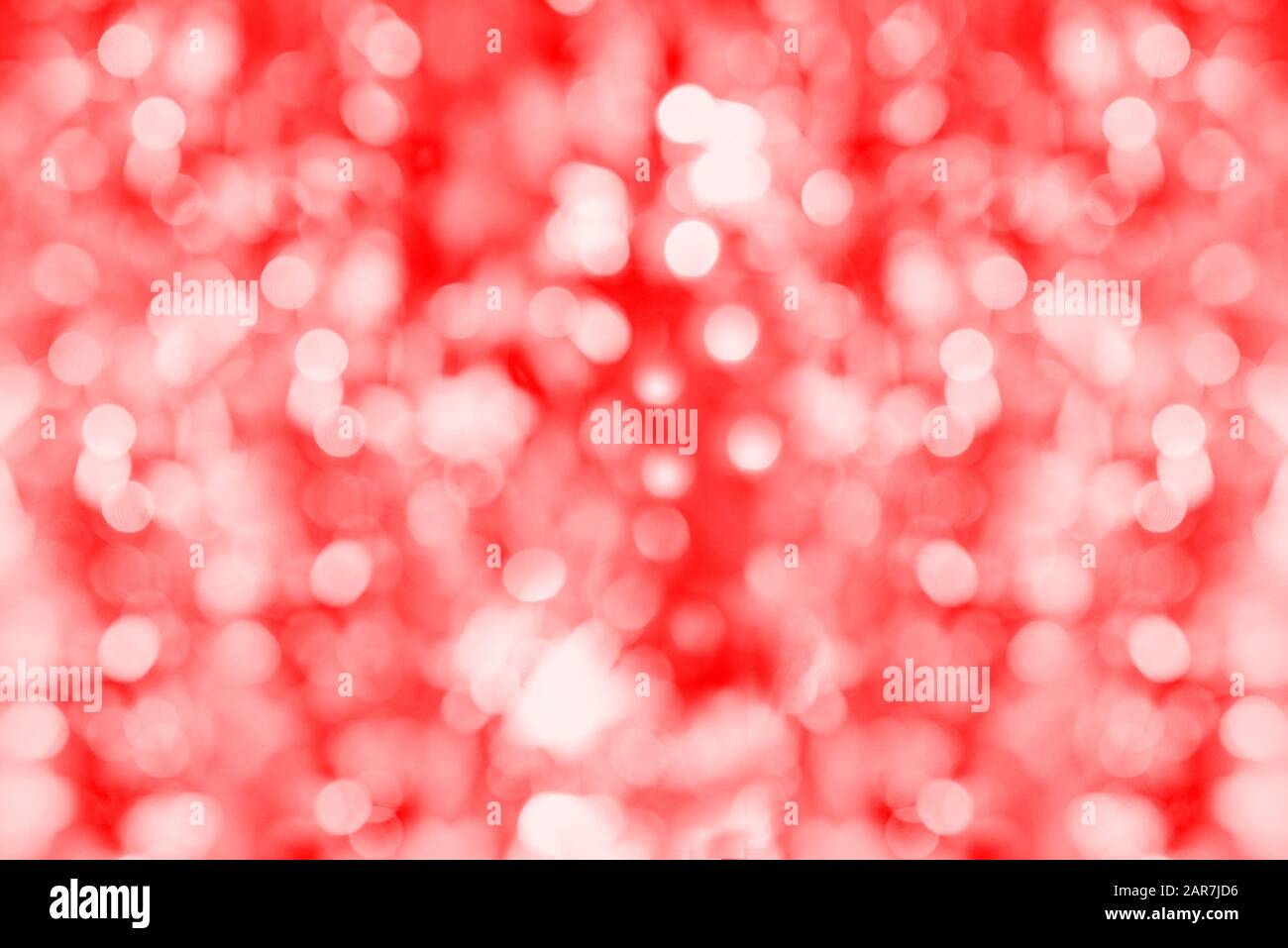 Red bokeh. Unobtrusive abstract background. Soft lights. Defocused blurred. Template for design with copy space Stock Photo
