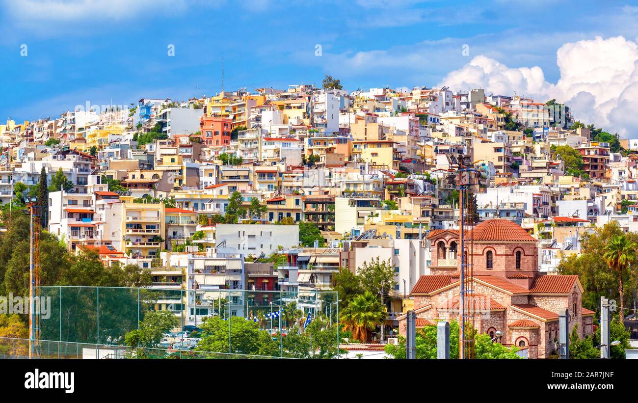 Panoramic view of Piraeus near Athens, Greece. Cityscape of Piraeus with colorful houses. Scenery of Greek city on hill in summer. Concept of travel a Stock Photo