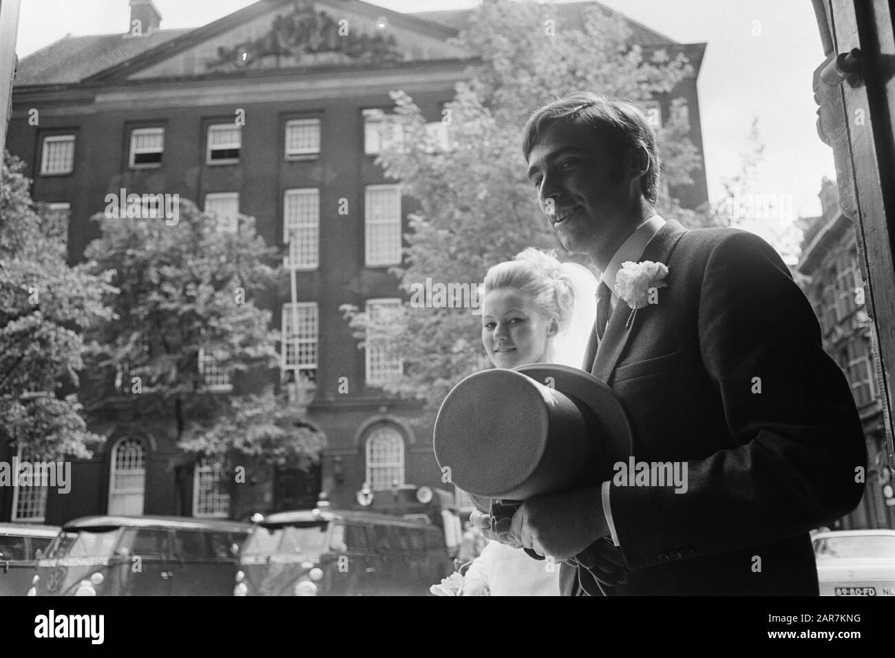 Political cordon around Virgin House just lifted up for newlyweds who had to go to church on Beguinage Date: 19 May 1969 Keywords: occupations, bridal couples, churches, students Institution name: Begijnhof Stock Photo
